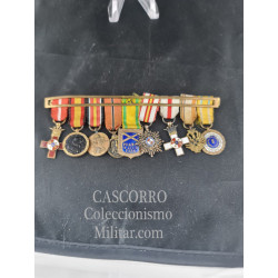 Pin of nine miniature medals.